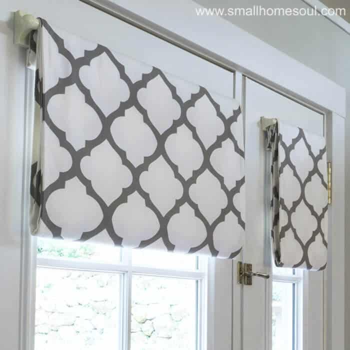 Closeup of simple french door curtains opened.