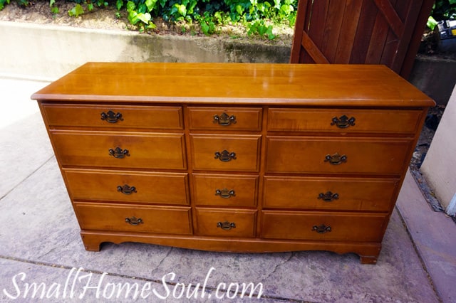 Old Dresser sitting on driveway ready fore a makeover