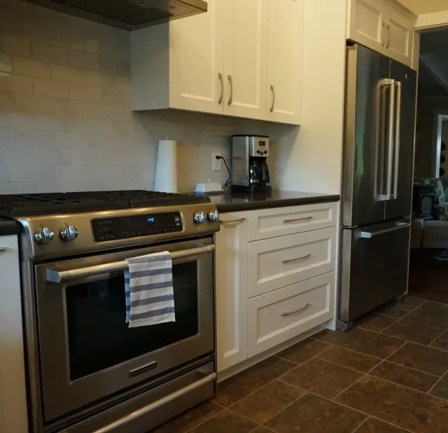 Kitchen Renovation completed, new slide in range and refrigerator.