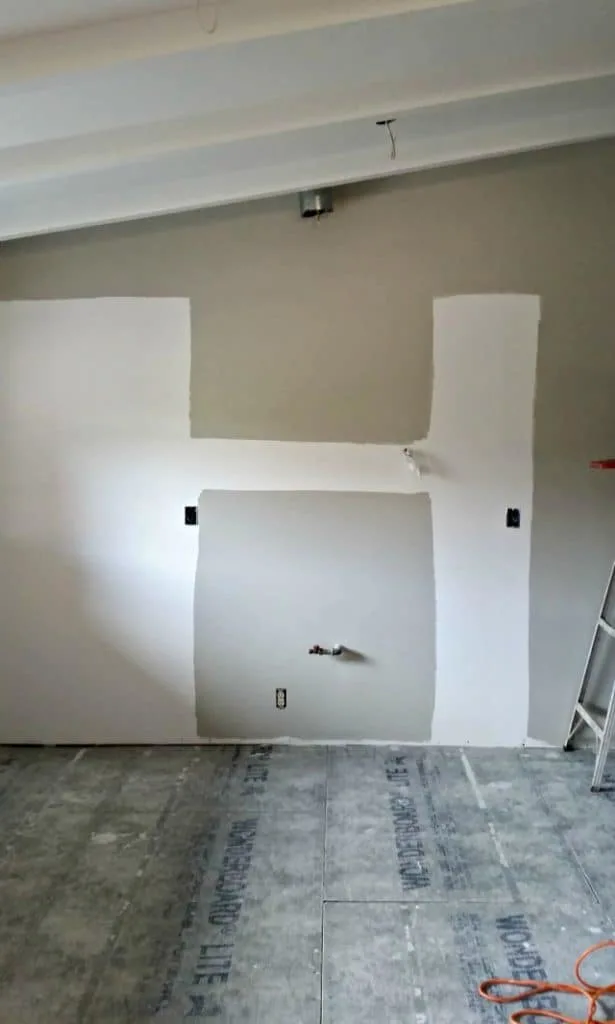 Painting kitchen walls gray before kitchen installation begins