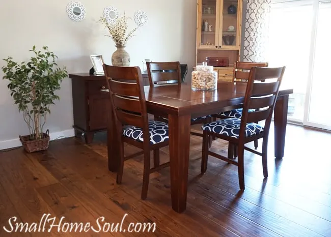 Newly reupholstered dining room chairs in blue fabric with white random circles.