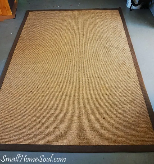 Before Painting a seagrass rug it's just a boring brown rug.