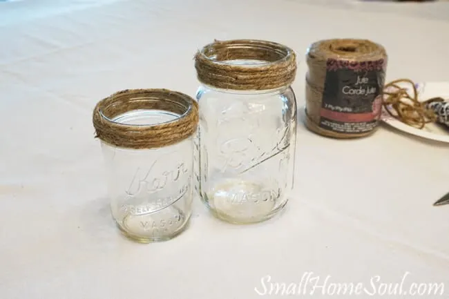 mason jars wrapped with jute twine at top.