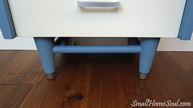 Finished and shiny feet of mid-century modern dresser.