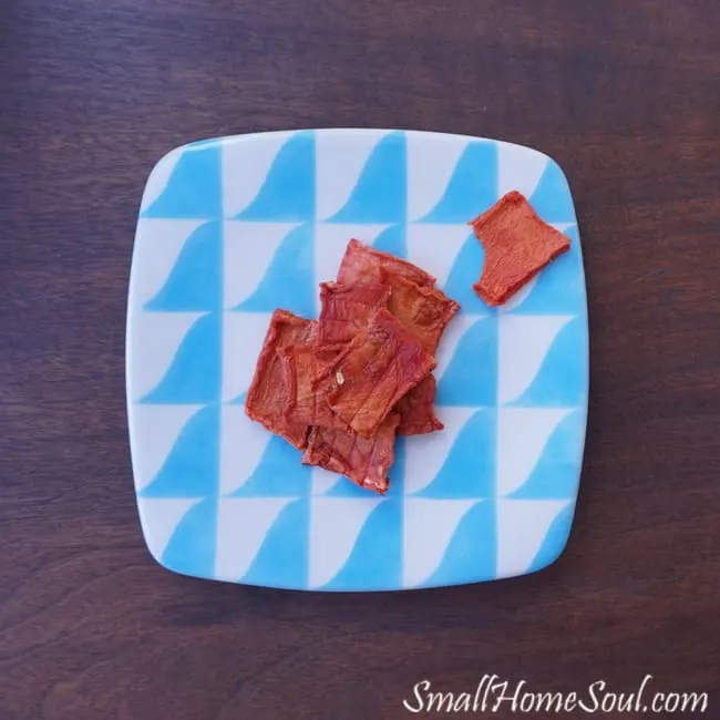 pile of watermelon candy on a blue and white plate