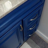 Love the new Indigo color on this cabinet. You have to see this beautiful Master Bathroom Makeover completed for less than $100!