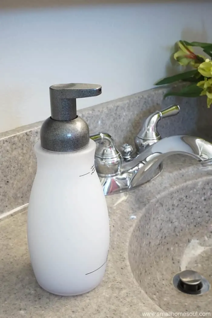 Updated foaming soap dispenser next to sink