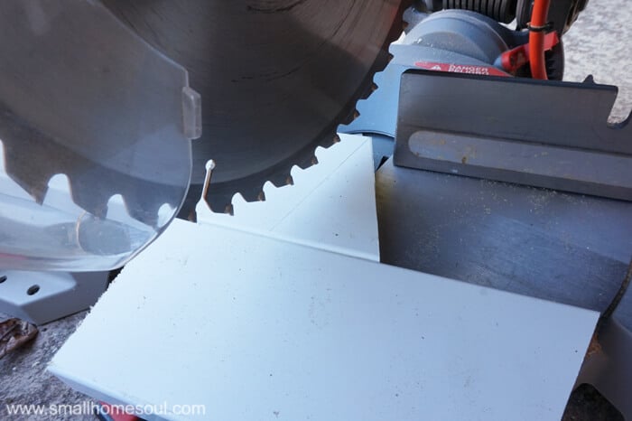 Preparing the miter saw to cut the top of the Christmas Tree.