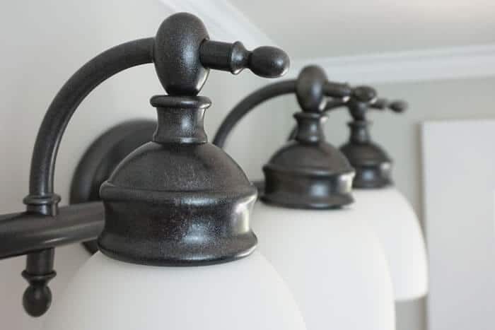 I love the finish on this bathroom light makeover. It looks brand new!