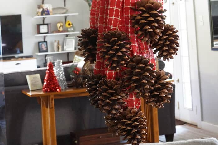 Make this quick and easy Pinecone Swag for beautiful but inexpensive Christmas decorating.