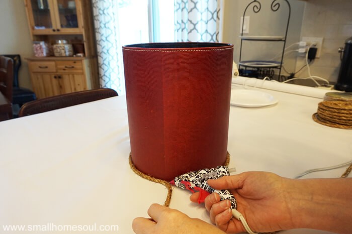 Glue gun attaching rope to Rope Planter Basket.