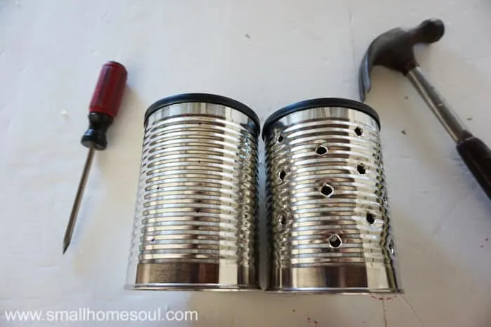 Tin cans side by side, one without holes, one with.
