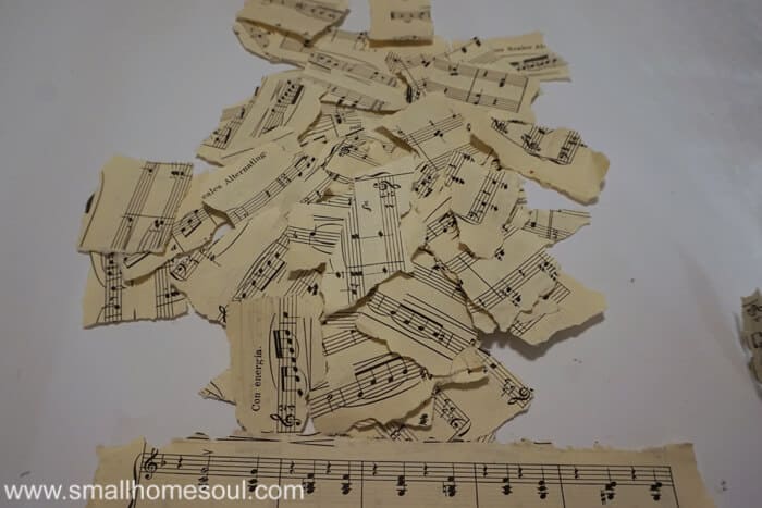 Torn sheet music pages ready to decoupage 