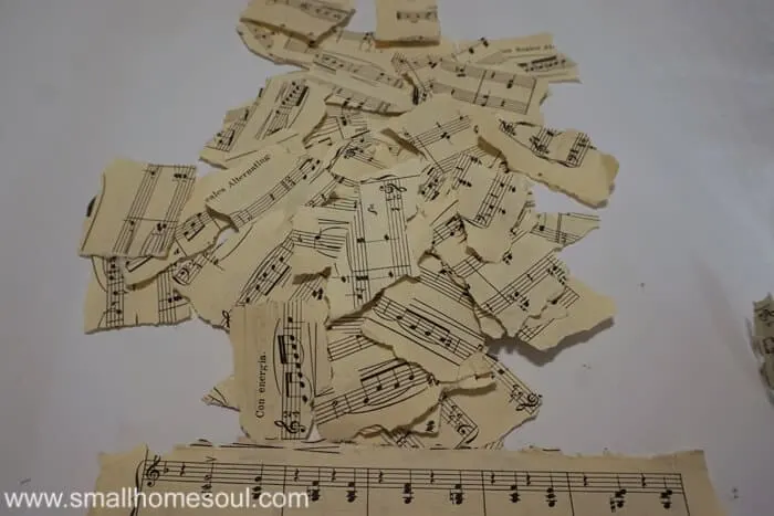 Torn sheet music pages ready to decoupage