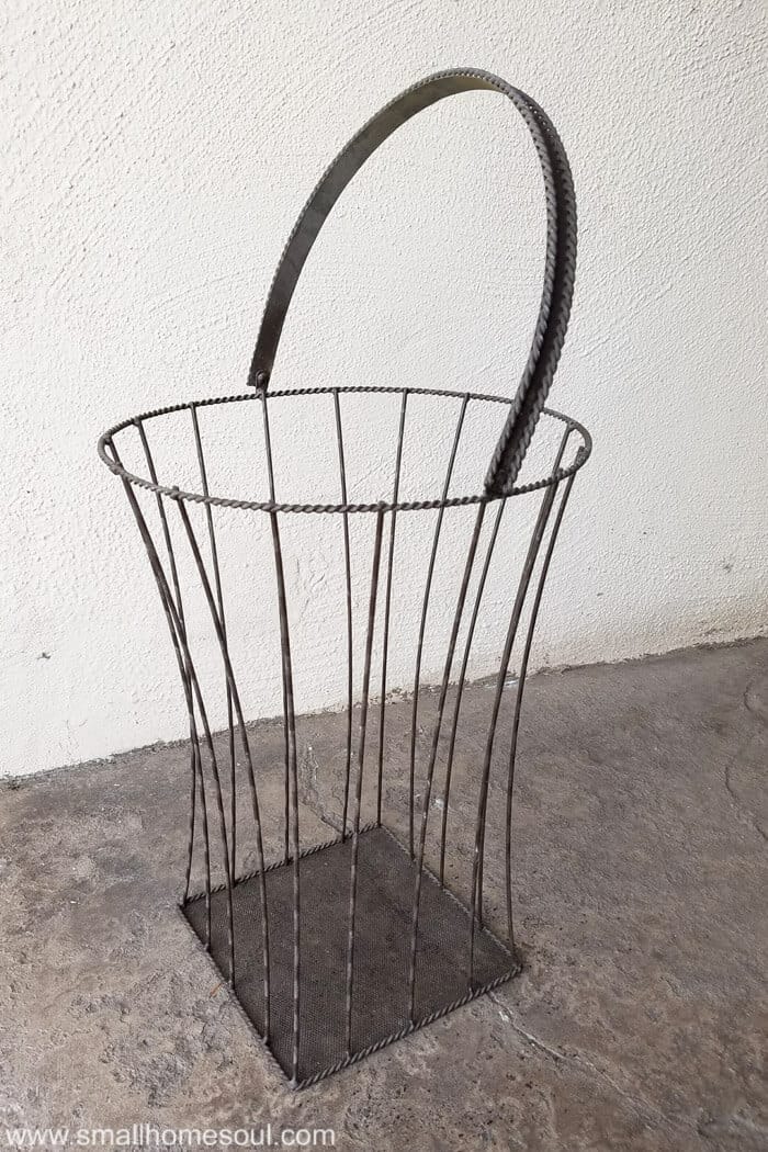 Empty basket ready to become outdoor plant stand.