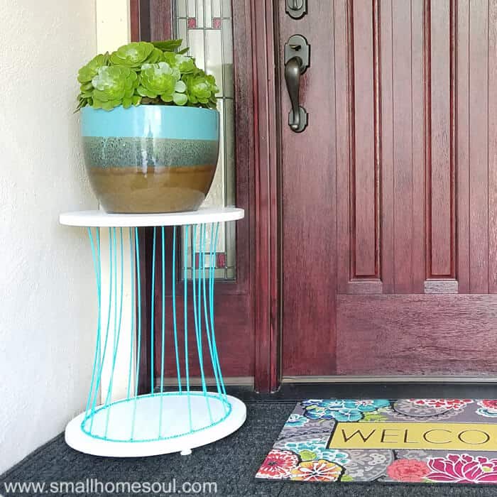 You can make an outdoor plant stand out of just about anything. I'll show you how I made mine from some plywood and an old basket from a garage sale.