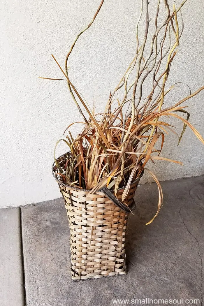Crusty basket from yard sale ready to become an outdoor plant stand.