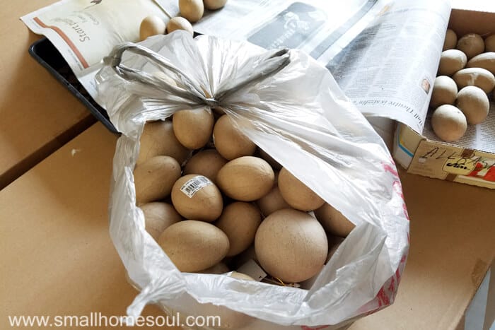 Bag of paper mache Easter eggs and round balls