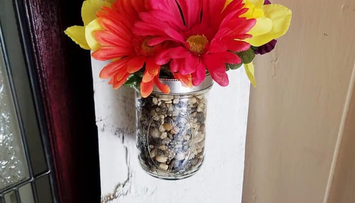 The flowers in this DIY Welcome Sign is a beautiful touch for any porch.