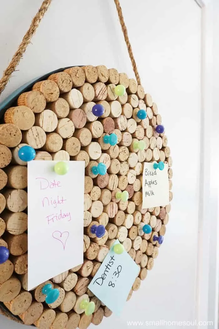 Closeup details of DIY wine cork board in use.