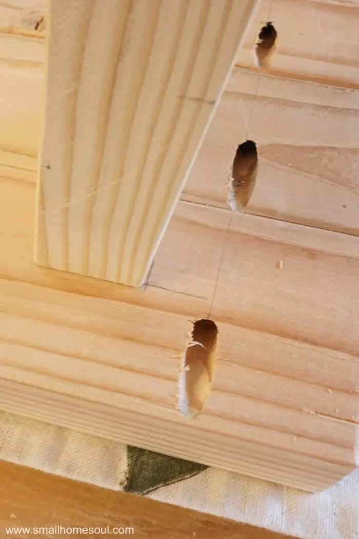 2x4 with pencil marks to attach base to top