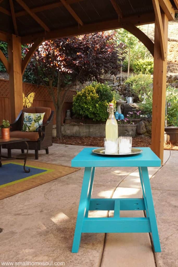 This 2x4 Outdoor Table is ready to serve refreshments to guests on the patio.