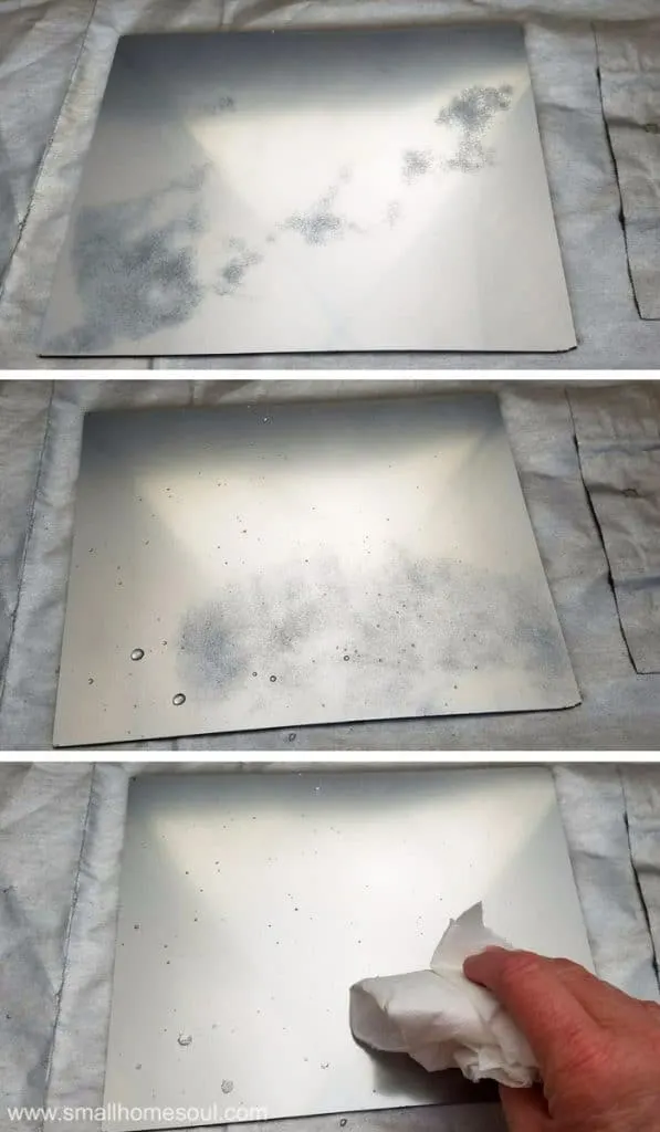 Process of painting with looking glass on a mirrored jewelry tray.