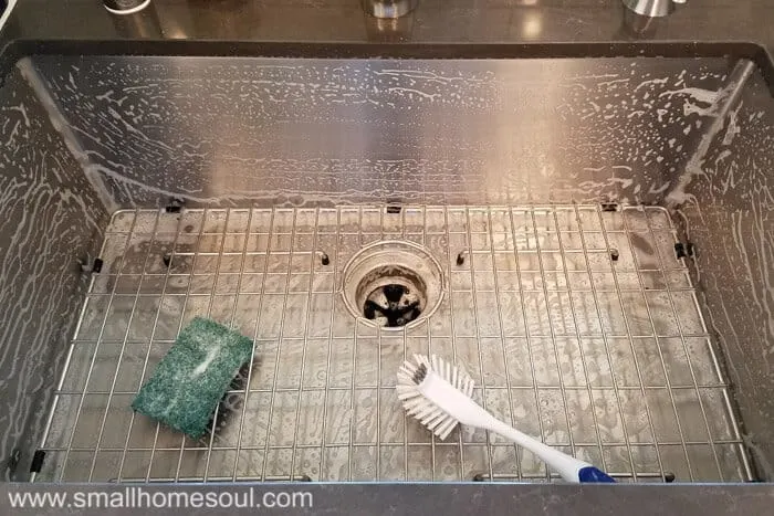 https://www.girljustdiy.com/wp-content/uploads/2017/09/Sink-Grid-Scrubbing-1.jpg.webp