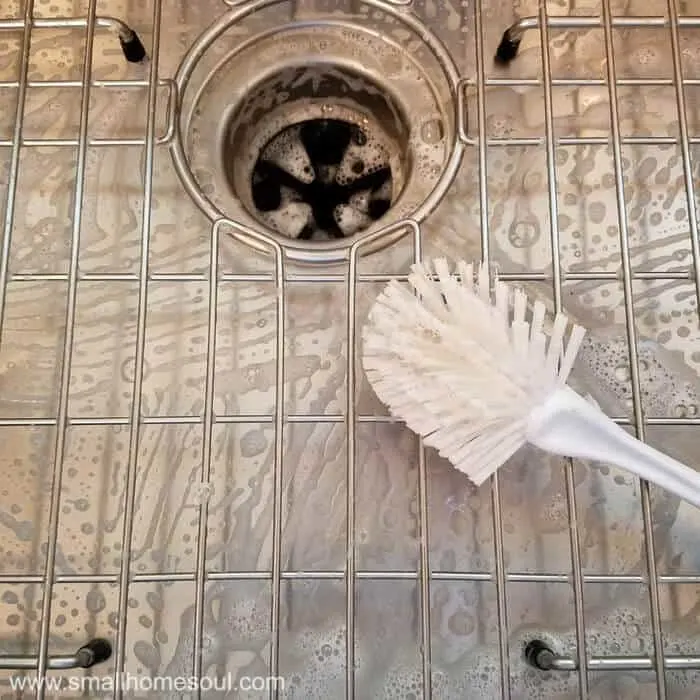 Kitchen sink grid all scrubbed and clean.