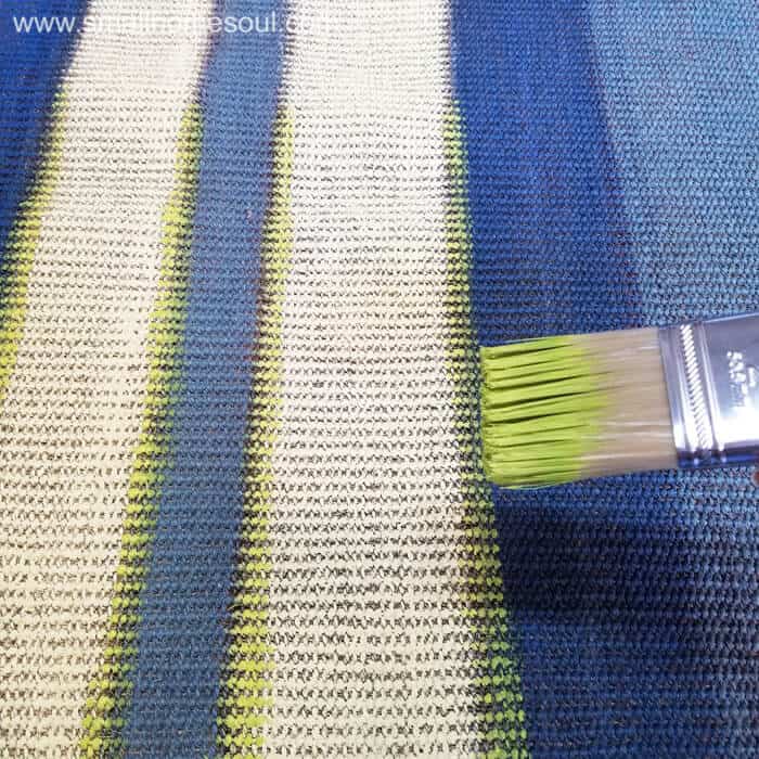 Paint a rug with accent stripes in green.
