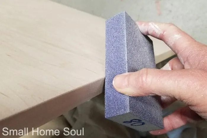 DIY L Shaped Desk edges get sanded.