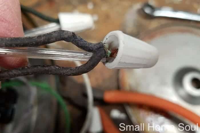 Triple wires getting wire nut in desk lamp makeover.