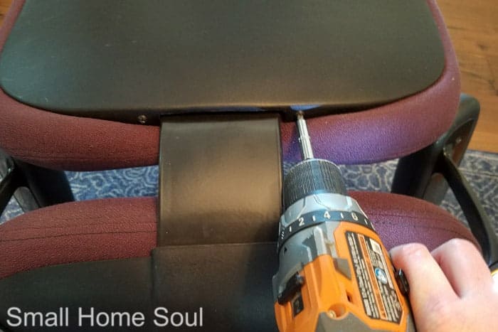 Take the back off of the office chair with a drill