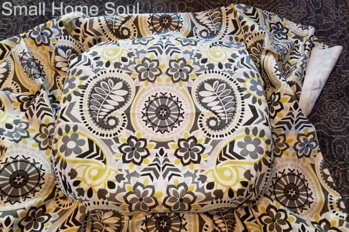 Place pattern of black and chartruese fabric on chair seat..