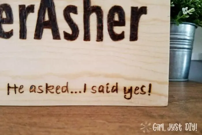 Closeup of saying on beginner wood burning sign.