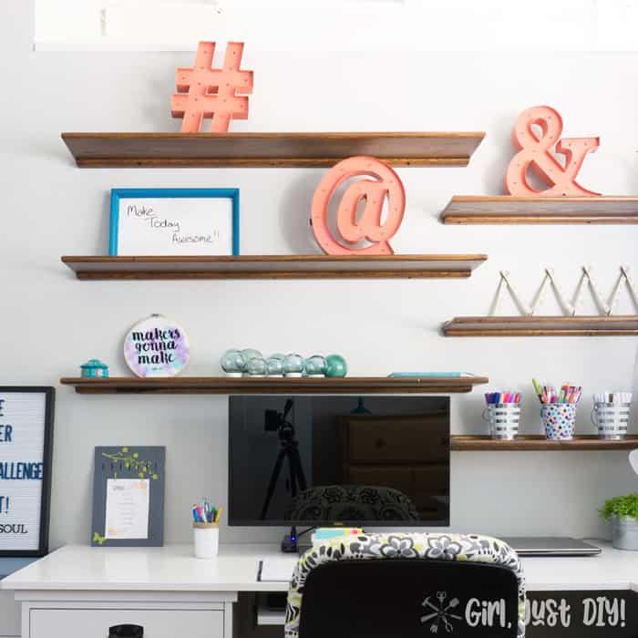 Square image of floating wood shelves.