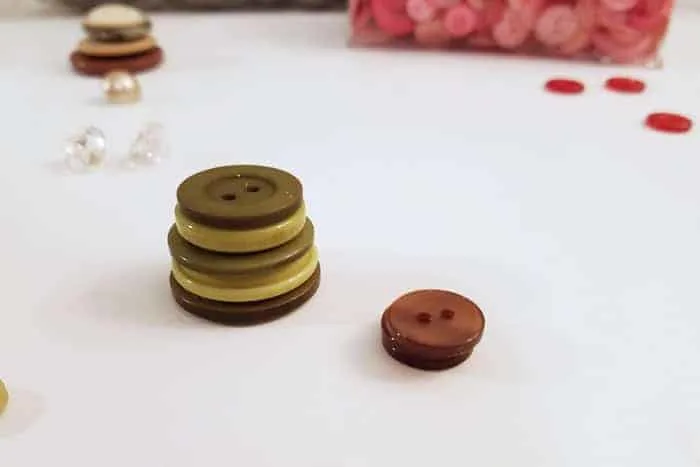 Stacked green buttons making a button tree.