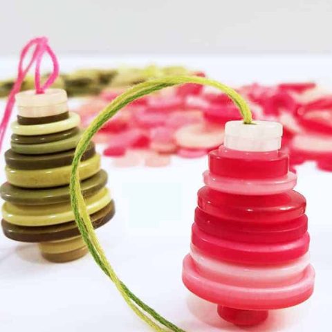 Pink and green button christmas ornaments as trees.