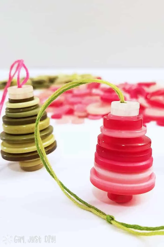 Pink and green button christmas ornaments as trees.
