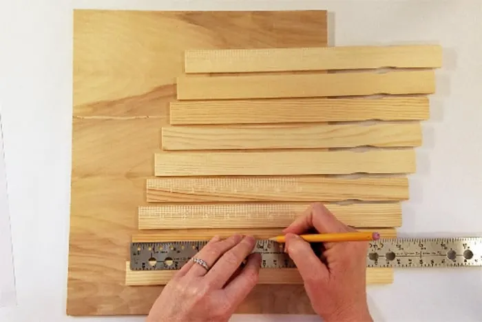 Paint sticks measured with ruler and marked.