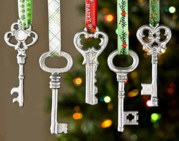 DIY Christmas Ornaments from old keys hung with pretty christmas ribbon.