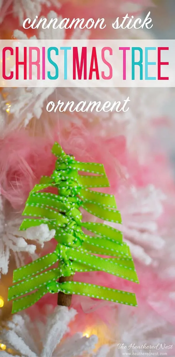 DIY Christmas Ornament green ribbon tied around cinnamon stick shaped like a tree.