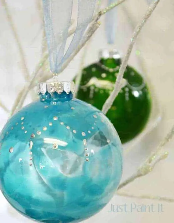 Painted glass bulb DIY Christmas Ornaments in blue and green.