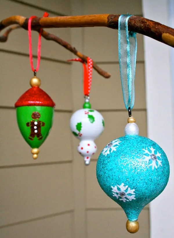 Colorful DIY Christmas Ornaments made with mod podge coated craft paint.