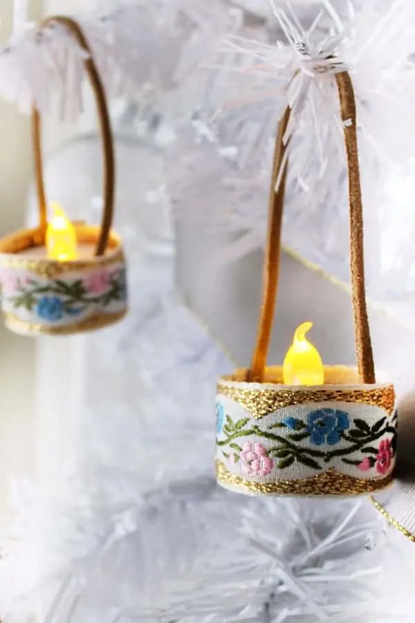 Mini Tealight DIY Christmas Ornaments wrapped with fabric ribbon.