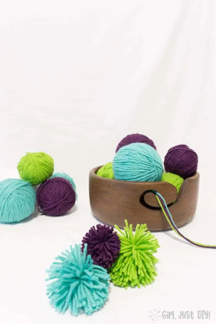 DIY Yarn Bowl stacked with colorful yarn balls.
