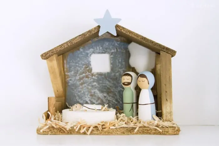Peg doll nativity scene in creche