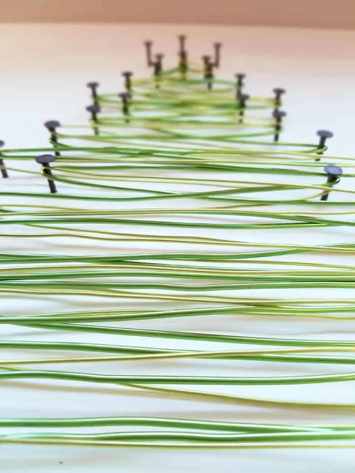 Closeup of overlapping wires of string art tree