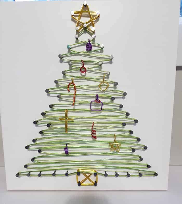 String Art Christmas tree with tiny ornaments.