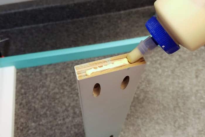 Wood glue applied to ends of cross support boards.